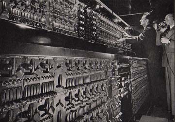 Light Director Eugene Braun supervises the operation of the light console with its 4,305 control handles.